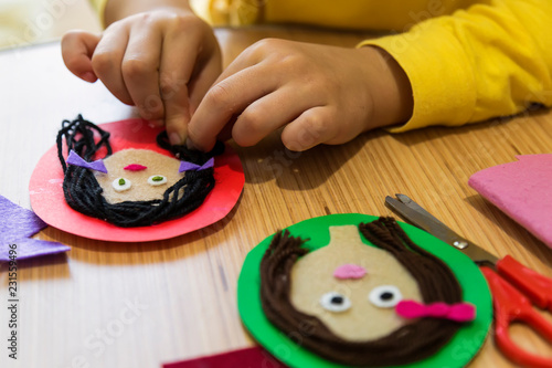making teacher and student pictures with felt,wool and carton for children’s activities in preschool or nursery.creative ideas for child development.back to school and happy teachers day concept.