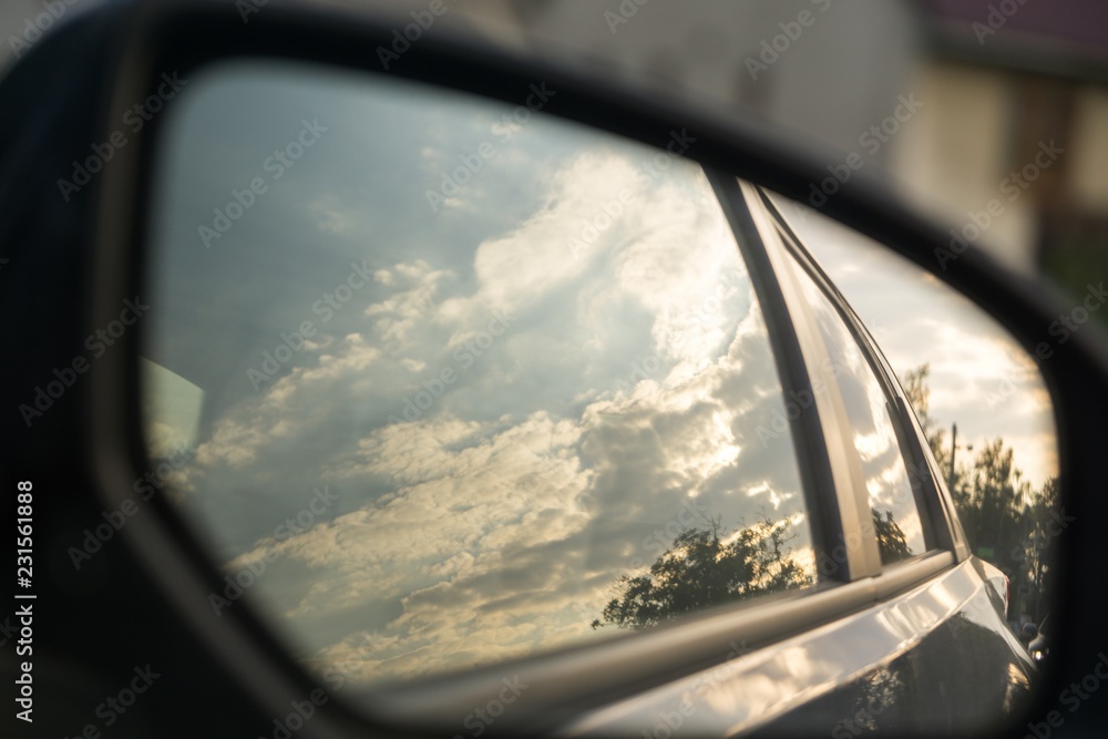 Sunset in rear car mirror. Czech Republic
