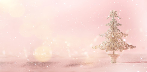 Silver glitter Christmas tree on pink background with lights bokeh, copy space. Greeting card for new year party. Festive holiday concept. Banner