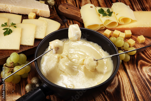 Gourmet Swiss fondue dinner on a winter evening with assorted cheese