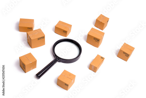 Cardboard boxes and a glass on a white background. The concept of packing goods, sending orders to customers. Warehouse of finished products and equipment. Moving to another house.