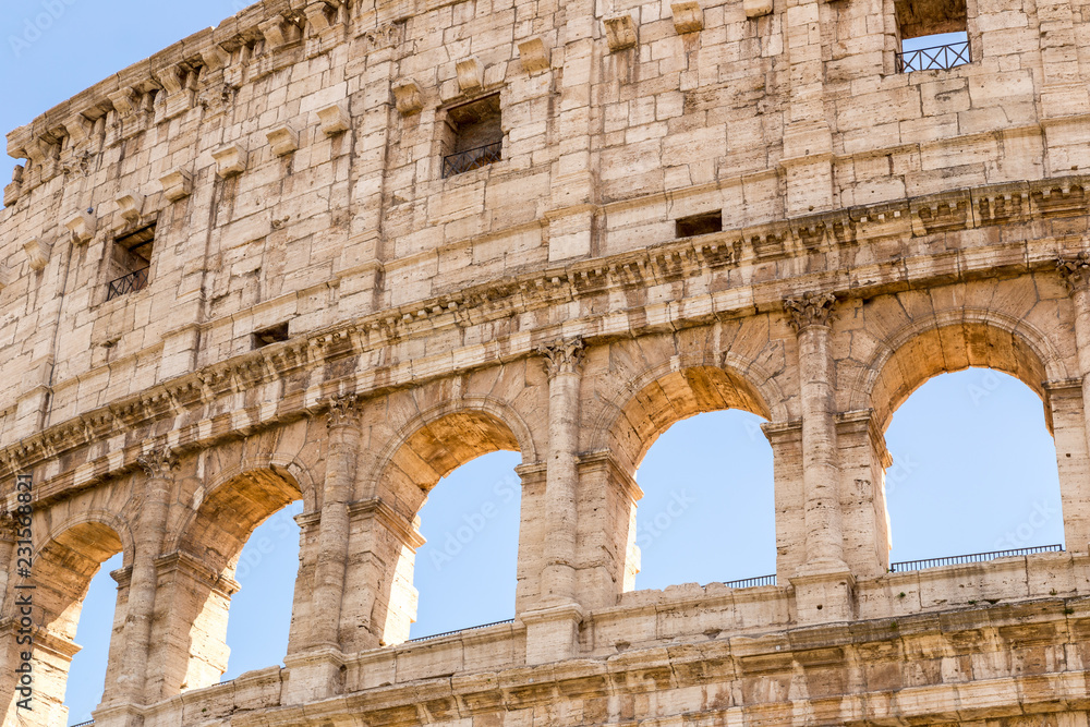 Obraz premium Colosseum with clear blue sky, Rome, Italy Rome landmark and antique architecture