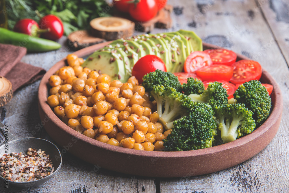Healthy vegan salad with avocado , chickpeas , broccoli , tomato Healthy vegan salad with avocado , chickpeas , broccoli , tomato