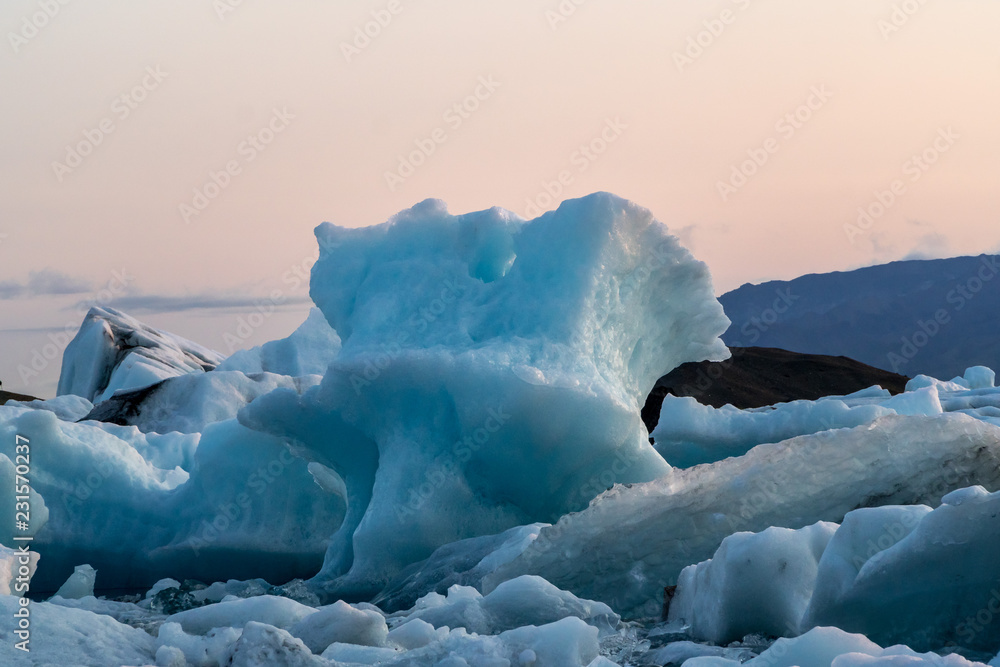 Fotografie Melting iceberg floating on the ocean