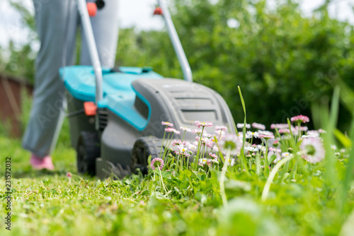 outdoor worker mowing the lawn