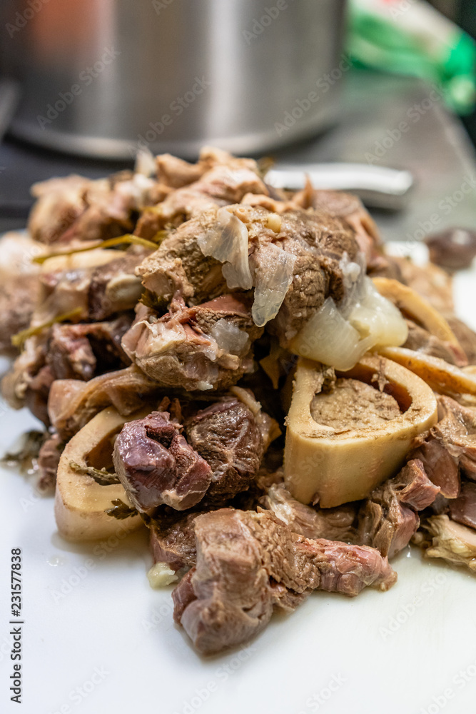 Freshly Boiled Pork on White Cutting Board on Table - Meal Preparation for Wedding Freshly Boiled Pork on White Cutting Board on Table - Meal Preparation for Wedding