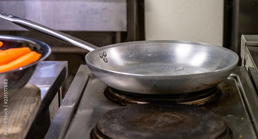 Isolated Empty Frying Pan on Stove Isolated Empty Frying Pan on Stove