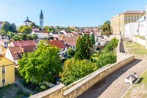 Litomerice cityscape with baroque St. Stephen's Cathedral and bell tower, Litomerice, Czech Republic. View from fortification walls and baileys. photo