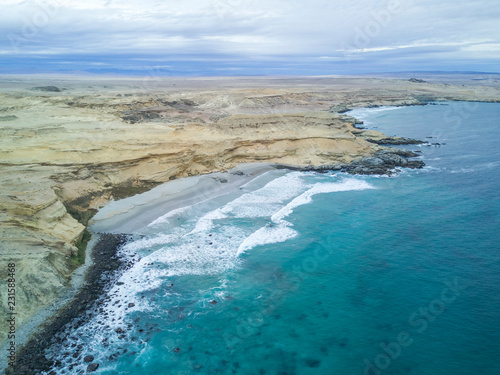 An aerial view of Atacama Desert at the coastal area at Chorrillos beach (Bahia Inglesa) an amazing landscape for geology with incredible sand formations and folds in the Earth, Copiapo, Chile © abriendomundo
