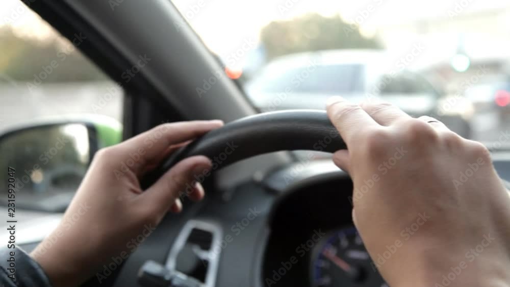 A man in a car driving a car through the streets A man in a car driving a car through the streets