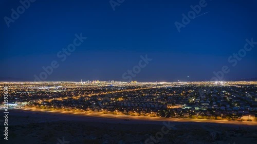 Western Las Vegas cityscape and night traffic in McCarran airport  time lapse