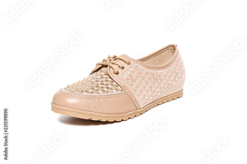 Women's platform beige shoes isolated on white background © GreenStock