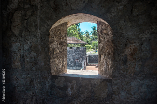 Looking out of the stone window of Castillo de San Felipe, a castle in Rio Dulce, east Guatemala 