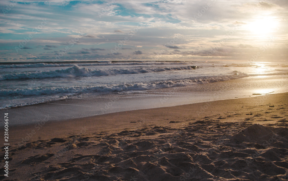 Waves lap at the beach during sunset in Santa Teresa, Costa Rica Waves lap at the beach during sunset in Santa Teresa, Costa Rica