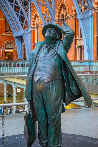 The Betjeman statue of sir John Betjeman at St. Pancras station in London, UK photo