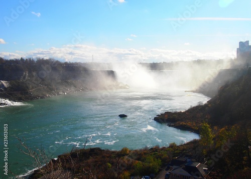 Niagara falls out of a different angle on a day with blue sky (Canada)