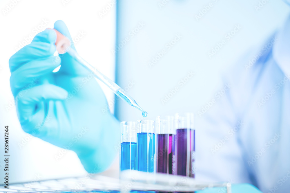 Scientist with equipment holding tools during scientific experiment science concept Scientist with equipment holding tools during scientific experiment science concept