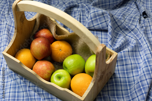 Orange, red apples, green apples in crates, fresh fruits