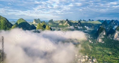 time lapse of aerial view of Karst mountains and beautiful cloudscape at sunrise. Located near The Ancient Town of Xingping, Yangshuo County, Guilin City, Guangxi Province, China.