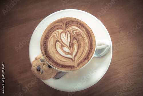 Nice coffee latte with cookie