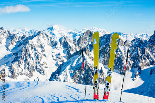 Ski in winter season, mountains and ski touring backcountry equipments on the top of snowy mountains in sunny day, Verbier Switzerland.