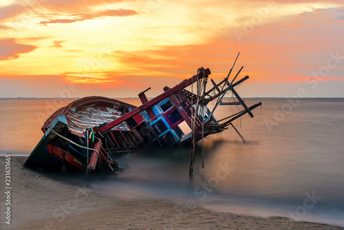 Shipwreck or wrecked boat on beach in the suset.  Beautiful Lanscape.  Pattay Thailand