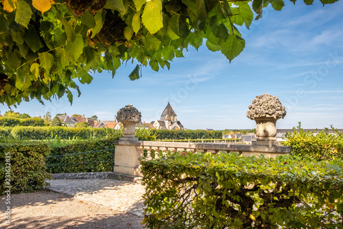 Billede på lærred Beautiful renaissance park with historic church on the background, chateau Villandry, Loire region, France