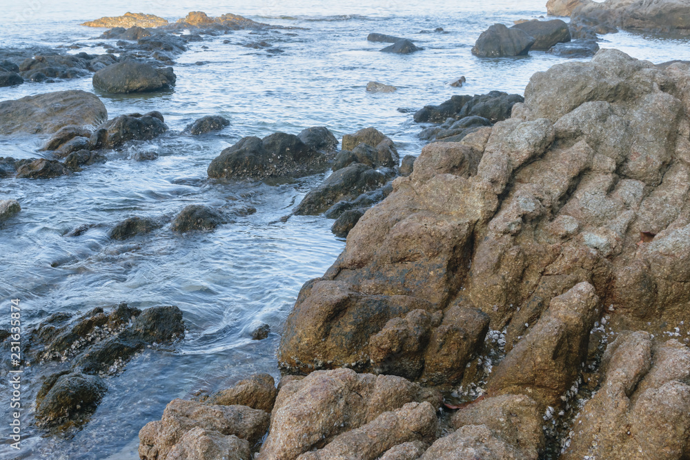 Rocks with wave at Surin Beach, Phuket, Thailand