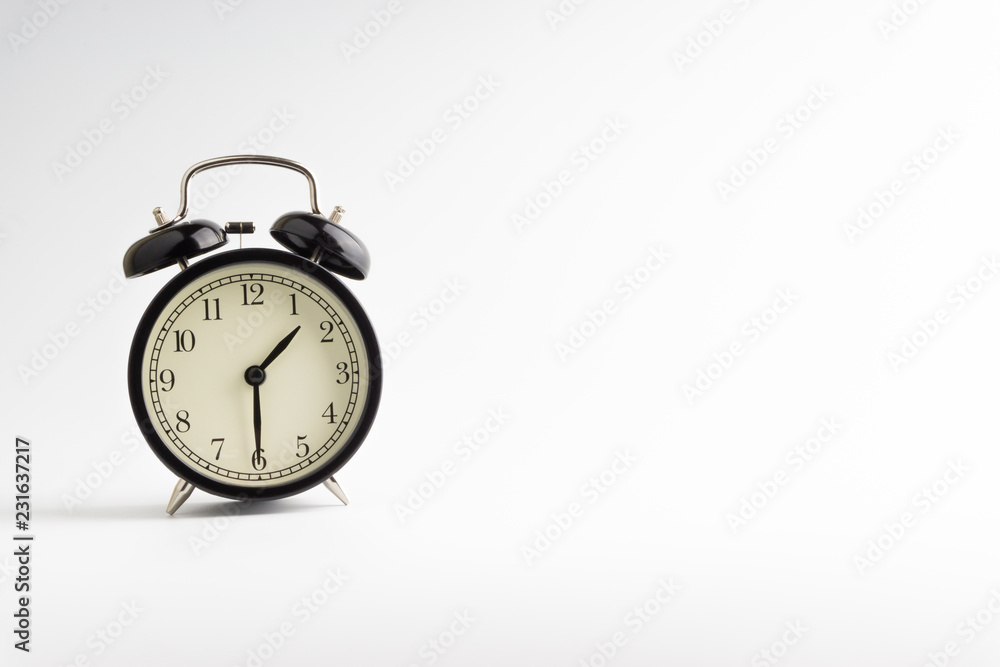 Alarm clock isolated on white background with selective focu Alarm clock isolated on white background with selective focu