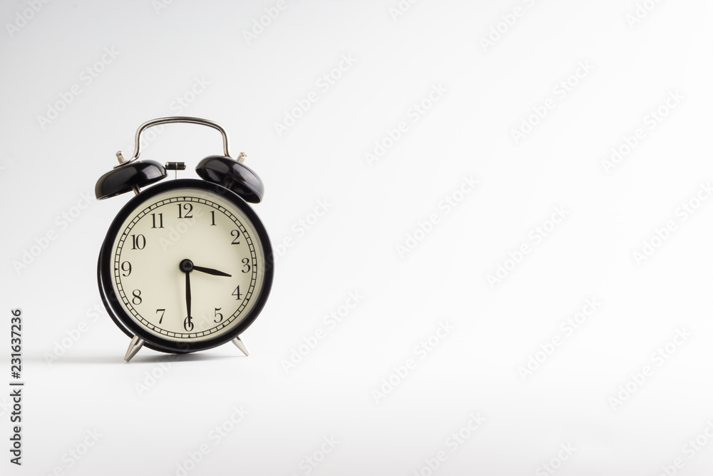 Alarm clock isolated on white background with selective focu Alarm clock isolated on white background with selective focu