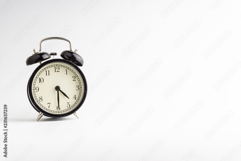 Alarm clock isolated on white background with selective focu Alarm clock isolated on white background with selective focu