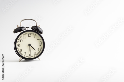 Alarm clock isolated on white background with selective focu