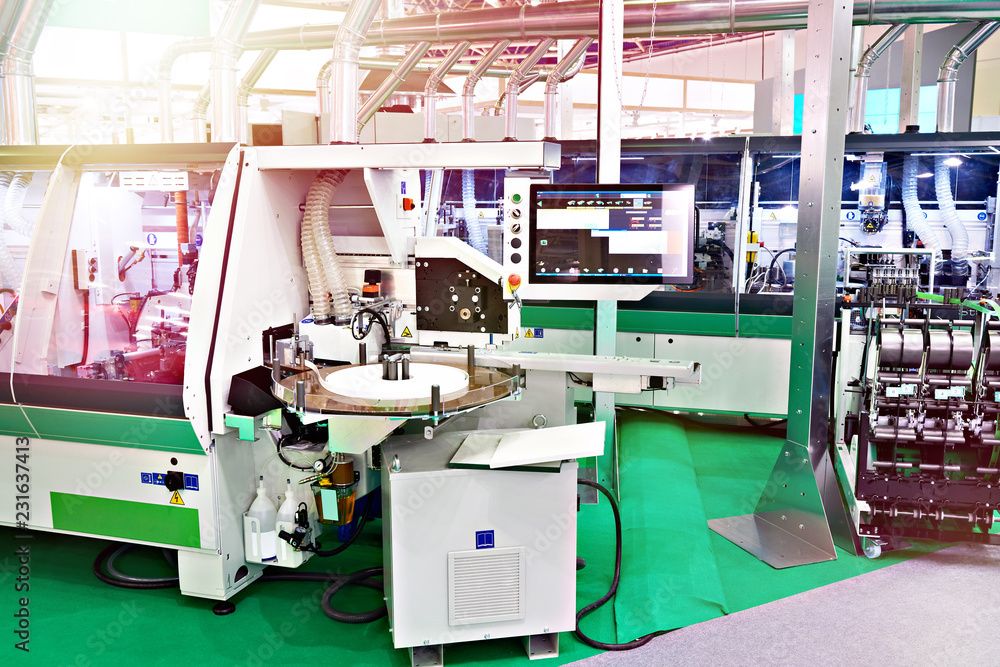 Industrial machines at wood furniture factory Industrial machines at wood furniture factory