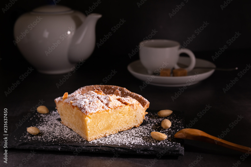 homemade almond frangipane cake in selective lighting homemade almond frangipane cake in selective lighting