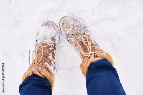 girl brown boots standing on snow