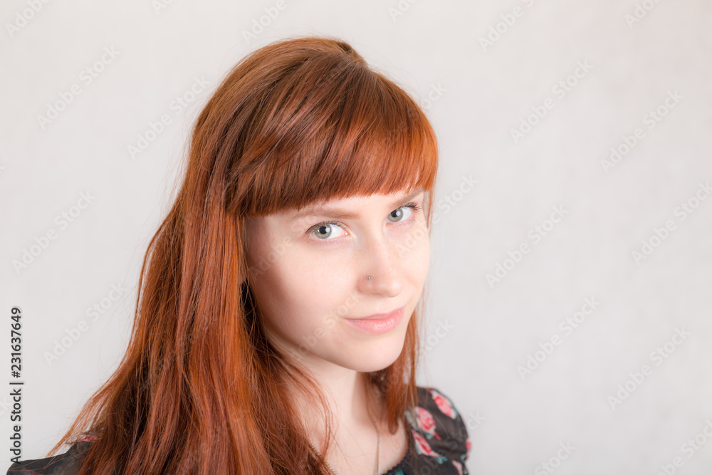 girl with long red hair closeup