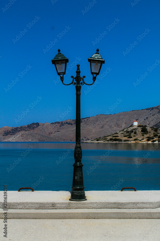 Street lamp with sea in the background, architectural detail