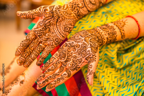 Mehndi Hands of an Indian Bride, tattooed with natural and local dye, Mehndi or Henna. during a Hindu wedding ceremony.