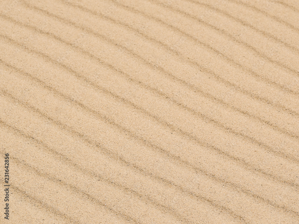 Diagonal waves of sand. Sandy texture background. Diagonal waves of sand. Sandy texture background.