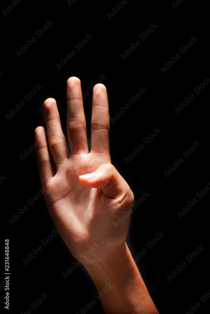 Hand figuring number 4 with fingers, isolated on black background. Hand figuring number 4 with fingers, isolated on black background.