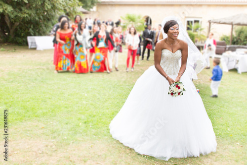 black bride throw the bouquet to unmarried girls guess in wedding day