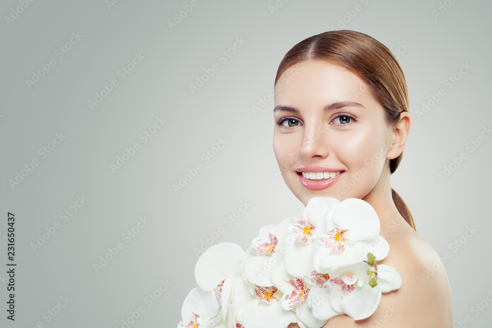Fototapeta premium Beautiful young woman with white orchid flower on banner background