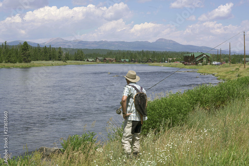 Fisherman flyfishing in river of Idaho state