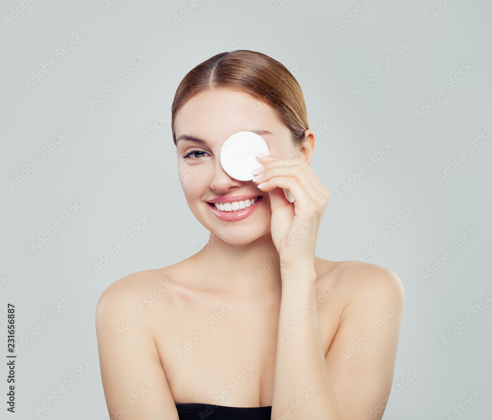 Smiling woman with cotton pads having fun Smiling woman with cotton pads having fun