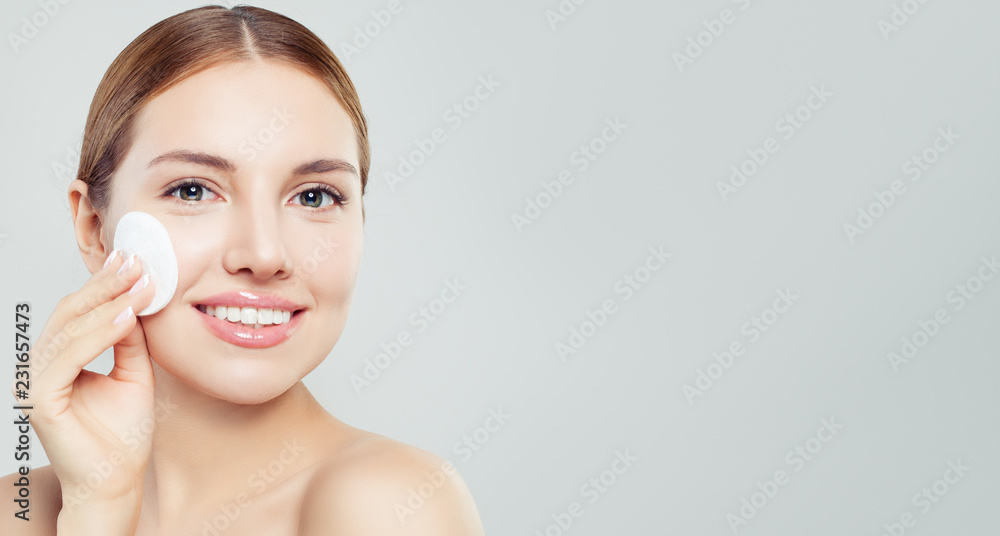Woman with cotton pad. Facial treatment, cosmetology, skin care