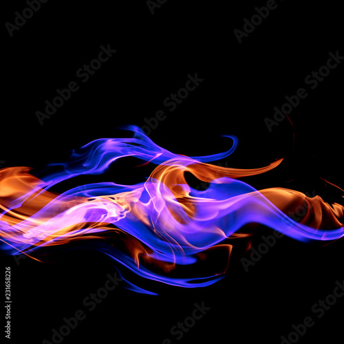 Fire - a wave of colored plasma fire elements consisting of a hot red-orange flame on a black background - a magical colored background for poster design