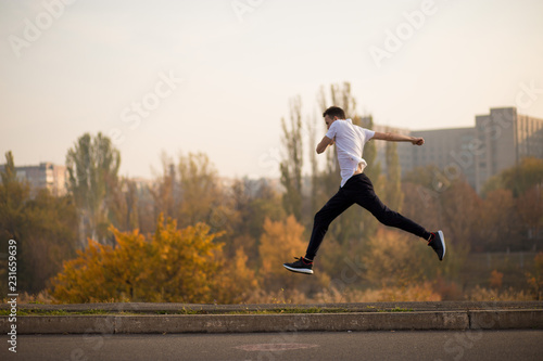 Man run at autumn morning. Healthy lifestyle concept
