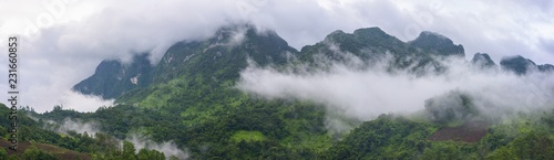 Panoramic mountains in the fog and clouds