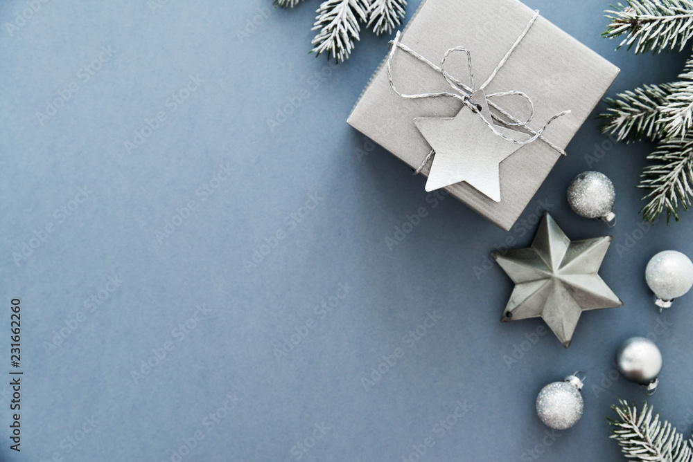 Christmas silver handmade gift boxes on blue background top view. Merry Christmas greeting card, frame. Winter xmas holiday theme. Happy New Year. Flat lay Christmas silver handmade gift boxes on blue background top view. Merry Christmas greeting card, frame. Winter xmas holiday theme. Happy New Year. Flat lay
