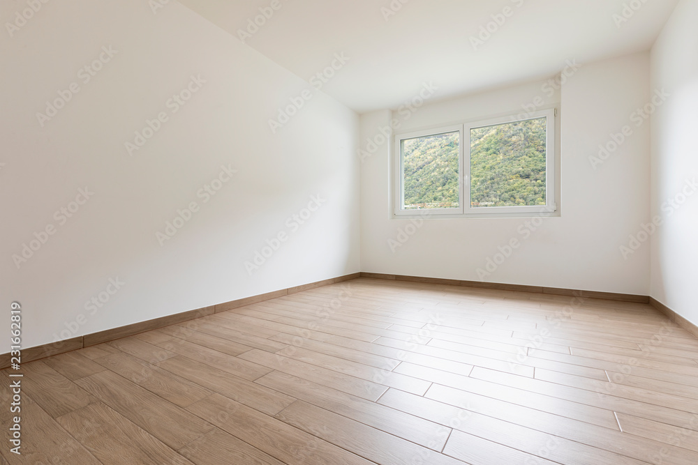 Fototapeta premium Empty room with white walls and window overlooking nature